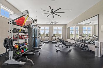 24/7 Fitness center with cardio and weight training